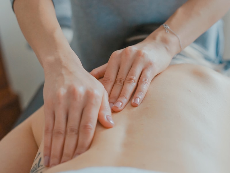 Treatment applied across the lower back and lumbar region of a client lying prone